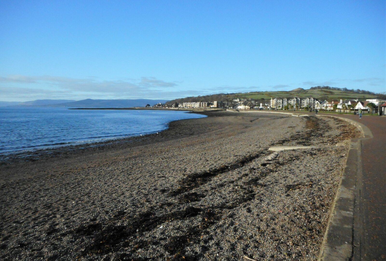 Largs promenade and the pebble shore of Largs Bay.